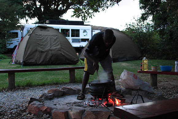 jaba preparing dinner over the fire