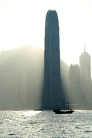 skyscraper blocking out the sun on the Hong Kong waterfront