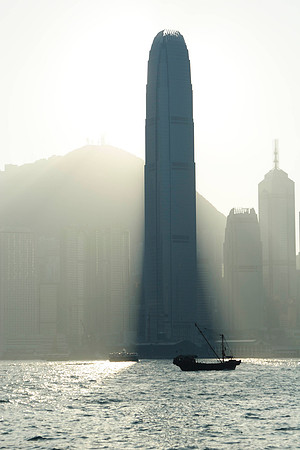 skyscraper blocking out the sun on the Hong Kong waterfront