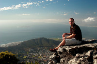 rick sitting on table mountain with the city and signal hill in the background