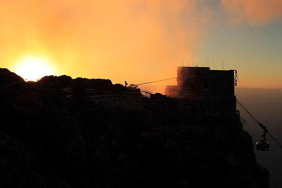 view from table mountain of the cable car returning to the lower station