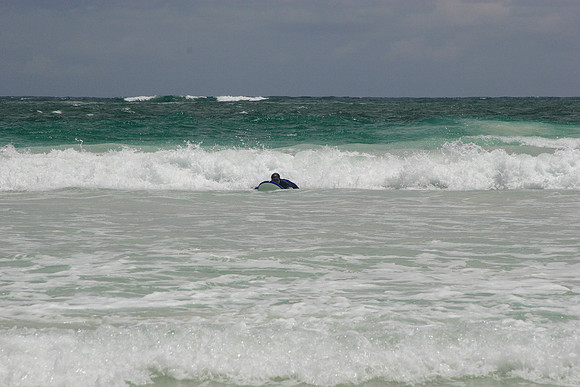 rick paddling just before catching the wave
