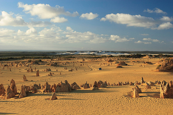 a lonely car in the pinnacles desert