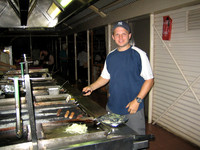 rick cooking kangaroo, crocodile and emu on the bbq