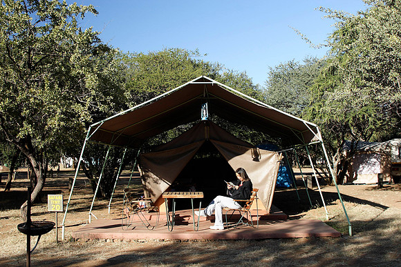 irene relaxing in front of our safari tent in pilansberg national park