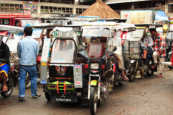 tricycles in the market in banahue