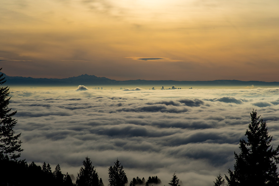 sunset over the fog in vancouver looking over metrotown